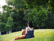 © Bo Bo/Stocksy - young Asian woman with dog outdoor