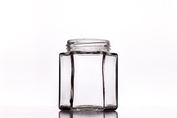 Sticker - Closeup shot of an empty glass jar isolated on a white background