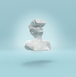 © Out of the box/Stocksy - A marble female statue levitating with a virtual reality headset