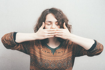 Wall Mural - woman covers her mouth