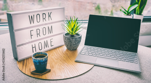 Fotomural Working from home remote work inspirational social media lightbox message board next to laptop and coffee cup for COVID-19 quarantine closure of all businesses