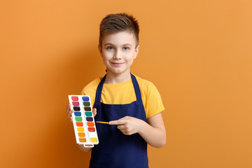 Wall Mural - Cute little artist on color background