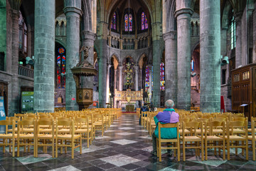 Dinant/Belgium - October 10 2019:  Rear or back view of one man sitting in church