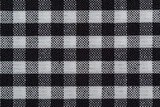 Fototapeta Dmuchawce - Checkered fabric background. Black cell. Top view, flat lay