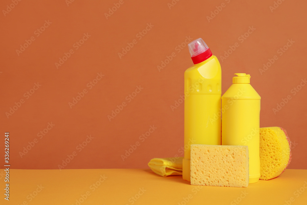 Set of cleaning supplies on color background