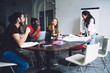 © BullRun - Young successful team discussing business plan