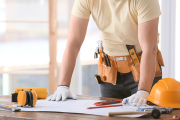 Wall Mural - Male builder working with house plan in office