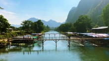 Picturesque Wooden Bridge Over The Nam Song River In Vang Vieng, Laos