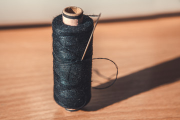 coil with black thread for sewing