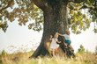 © Volodymyr - Overcoming the fear of heights. Happy children on countryside. Climbing trees children. Little boy and girl climbing high tree. Funny brother and sister.