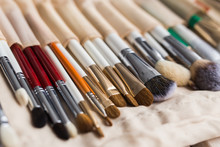 Makeup, Beauty And Cosmetics Concept - Set Of Make-up Brushes In A Light Case.