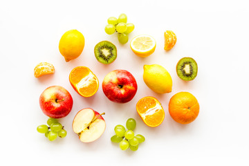 Colorful summer fruits background on white table top view