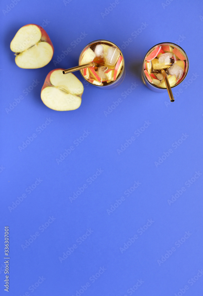 Glasses of tasty cold ice tea on color background