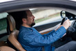 © Jasmin Merdan - Young and rich male driver in car