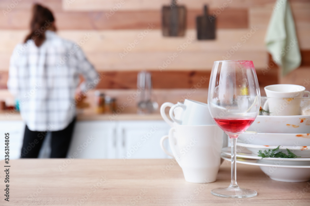 Many dirty dishes on kitchen table
