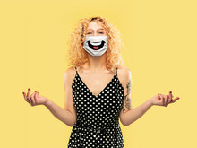 Happy Laugh. Portrait Of Young Caucasian Woman With Emotion On Her Protective Face Mask Isolated On Studio Background. Beautiful Female Model. Human Emotions, Facial Expression, Sales, Ad Concept.