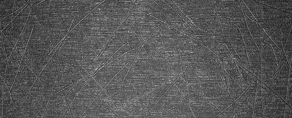 Texture of black plastic with scratches.Rough plastic background.