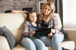 © DC Studio - Sad little girl while watching a movie on tablet