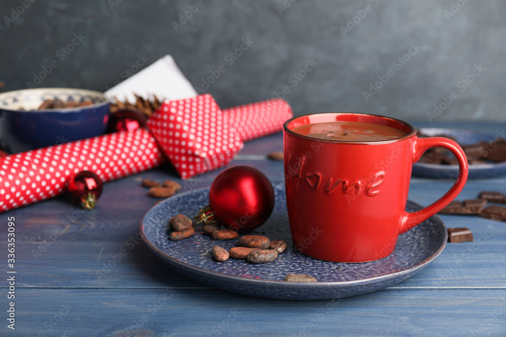Cup of hot chocolate and Christmas decor on table