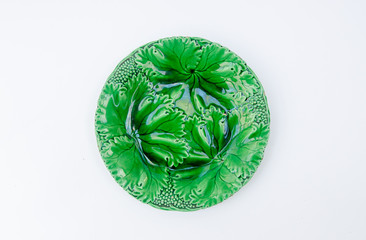 Old majolica plate with green leaves pattern - grapes leaf porcelain plate -  isolated on white background