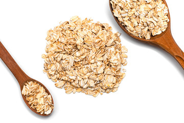 oat flakes and two wooden spoon on a white background