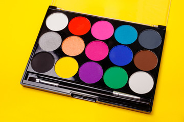 Various colorful bright eye shadows backdrop. Make up palette set