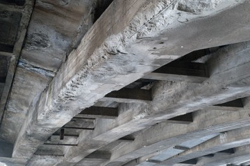 Wall Mural - old weathered concrete beam under a bridge