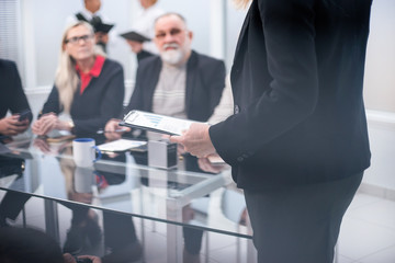 Canvas Print - close up. the Manager makes a report at a meeting in the office