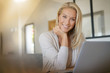 © goodluz - woman telecommuting on her laptop computer at home