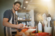© goodluz - Middle-aged man cooking in his kitchen