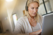 © goodluz - woman telecommuting on her laptop computer at home
