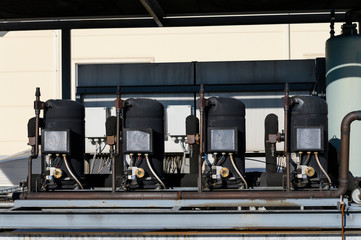 Wall Mural - Compressors from cooling units on the roof.