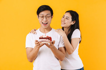 Poster - Image of multinational couple holding cake while celebrating birthday