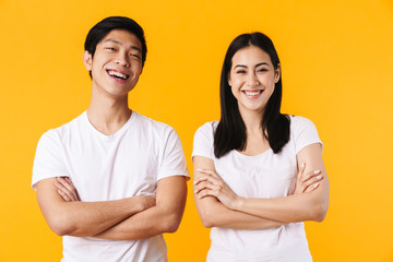 Wall Mural - Image of multinational man and woman laughing with hands crossed