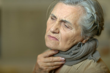 Poster - Close up portrait of sad ill senior woman