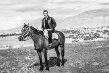 Man Horse Riding In Patagonia