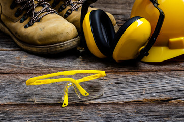 Canvas Print - Standard construction safety and equipment on wood background