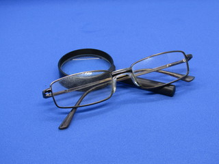 Glasses for improving vision and magnifying glass.