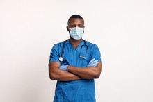 Confident Black Doctor In Face Mask And Gloves Over White
