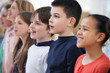 © highwaystarz - Group Of School Children Singing In Choir At Stage School Together