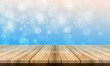 © Dompet Masa Depan - Empty wooden table with a beautiful colour bokeh background