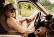 © Michael Marquand - young woman relaxing in her truck