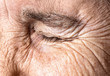 © Dmytro - Old age concept. Close-up eye of an elderly woman with a wrinkled face.