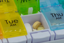 A Close Up Of Pills Inside A Pill Box Or Medication Box Used For Counting Out Medication For The Week