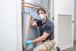 © spatesphoto - HVAC worker replacing filter