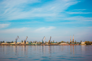 Large cranes by the river