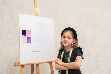 Canvas Print - Cute little dressmaker on light background