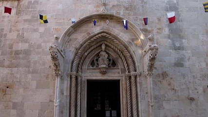 Wall Mural - Cathedral of Saint Mark doorway in Korcula old town, Croatia. Korcula is a historic fortified town on the protected east coast of the island of Korcula