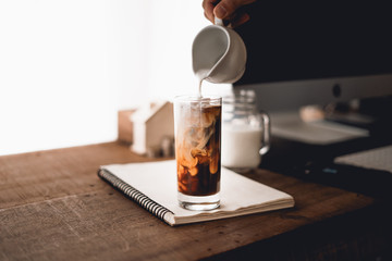 Iced coffee, put milk in a glass