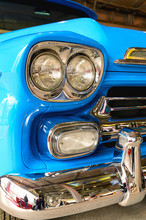 A Fragment Of The Front Of The Car Close-up. Headlight And Bumper Of The Car.